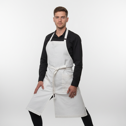 Man wearing a white apron on a plain background